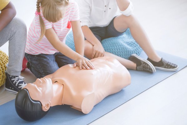 Young girl performing cpr CPR training Canberra